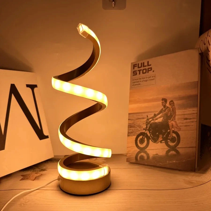 Modern spiral LED table lamp for desk and home lighting decor.