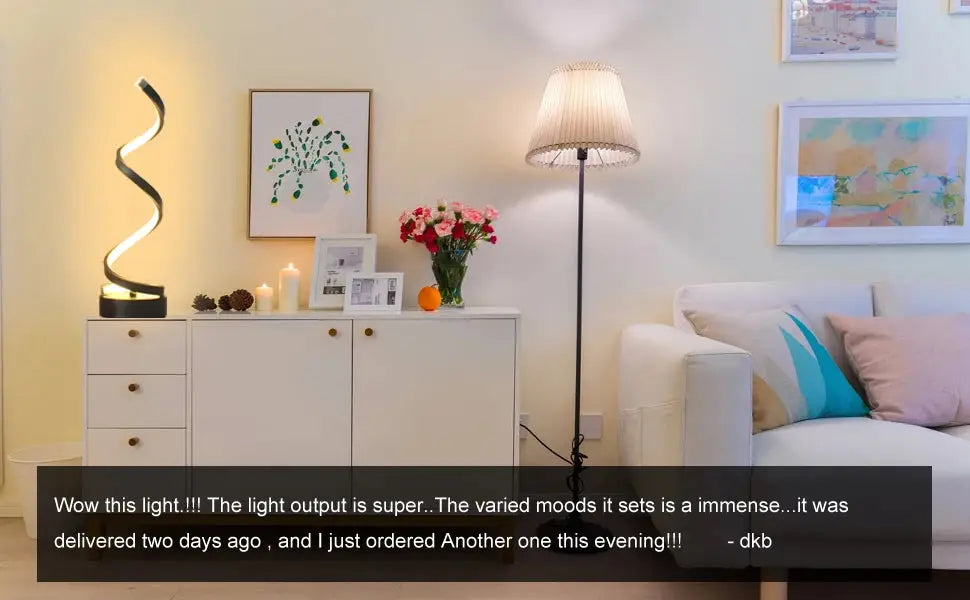 Modern dimmable spiral LED table lamp for desk and home lighting.
