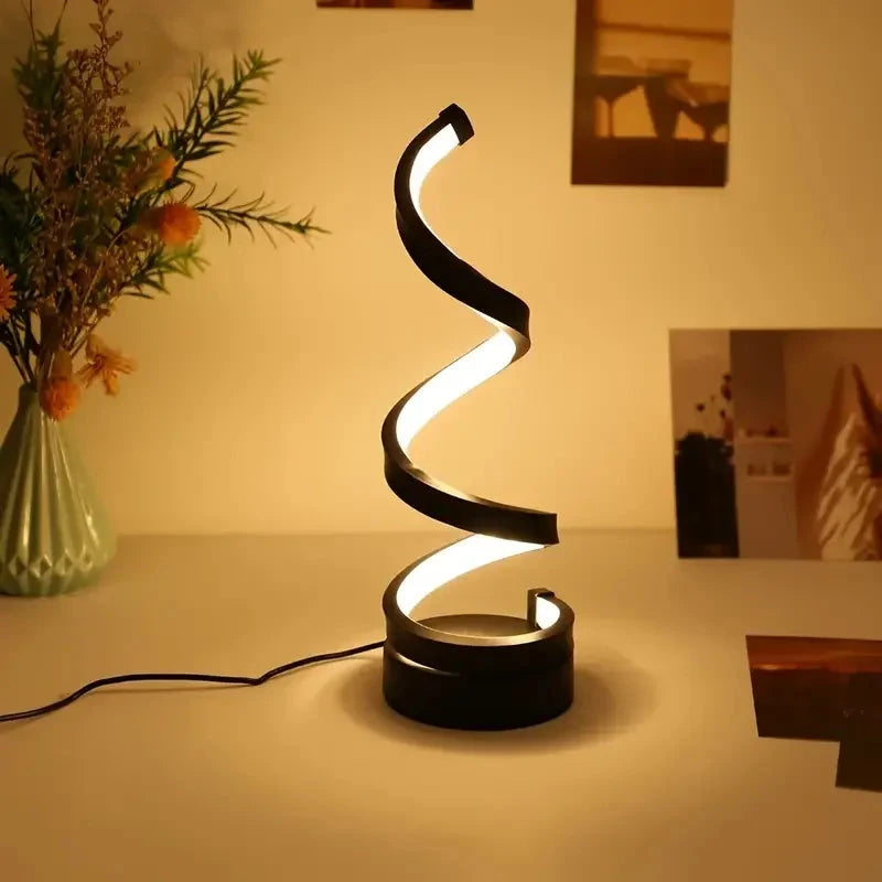 Modern spiral LED table lamp for desk and home lighting decor.