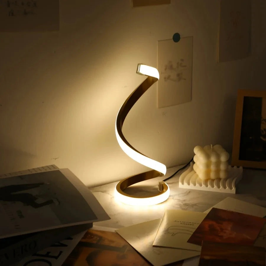 Modern spiral LED table lamp for desk and home lighting decor.