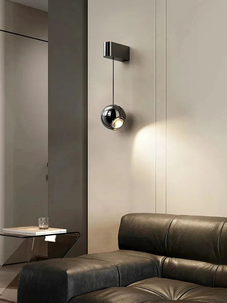 Modern adjustable LED bedside wall lamp for bedroom lighting and decor.