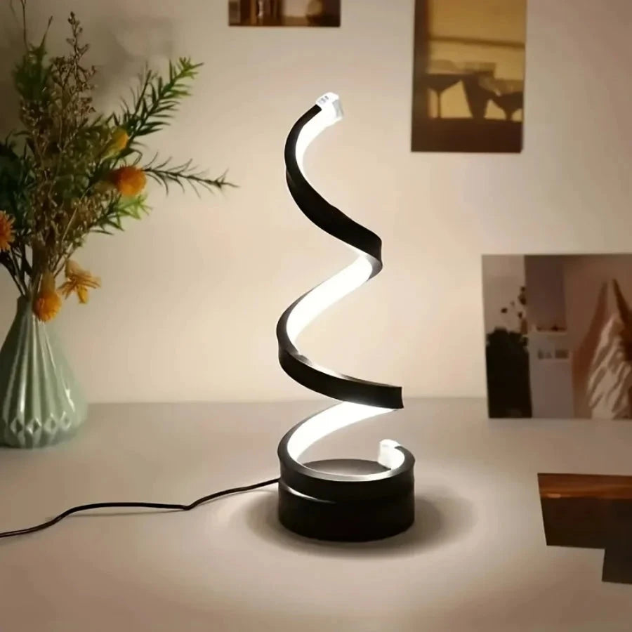 Modern spiral LED table lamp for desk and home lighting decor.