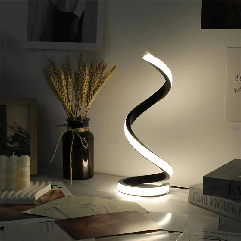 Modern spiral LED table lamp for desk and home lighting decor.