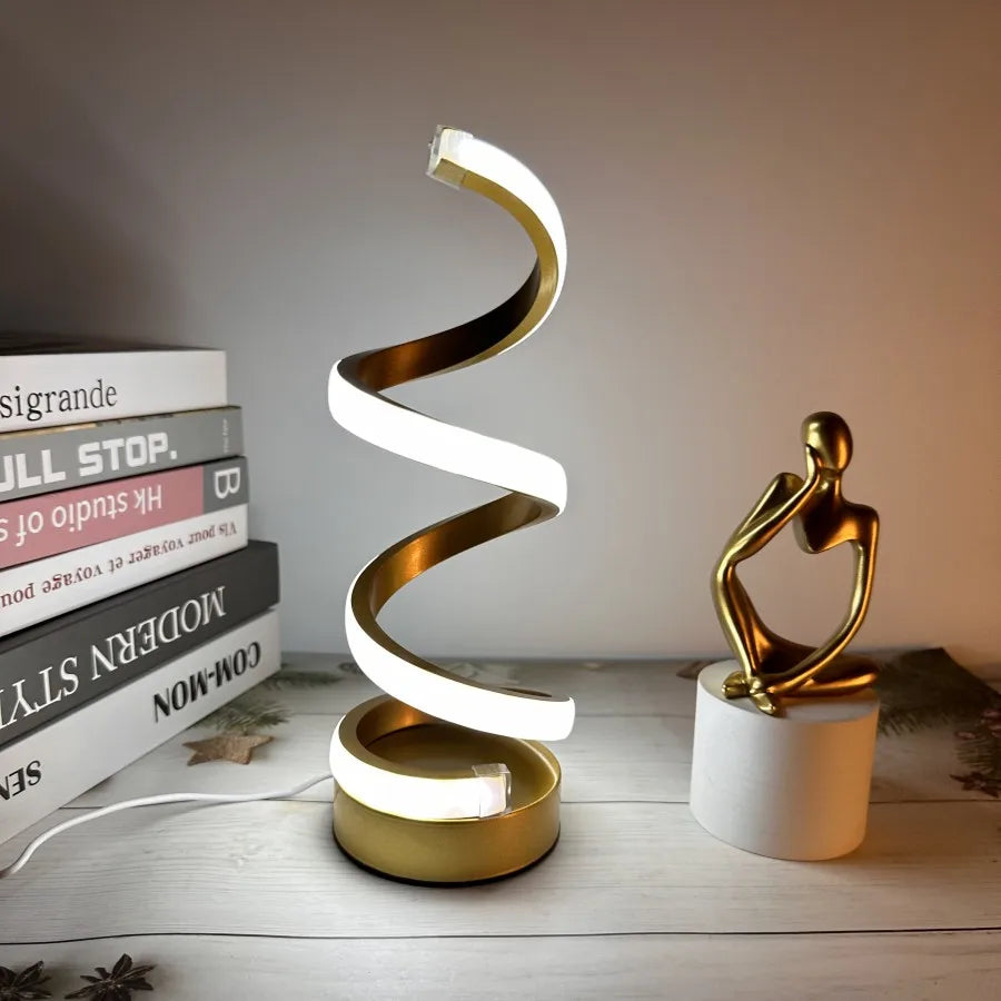 Modern spiral LED table lamp for desk and home lighting decor.