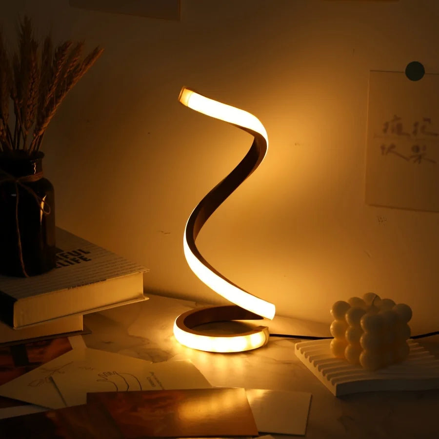 Modern spiral LED table lamp for desk and home lighting decor.