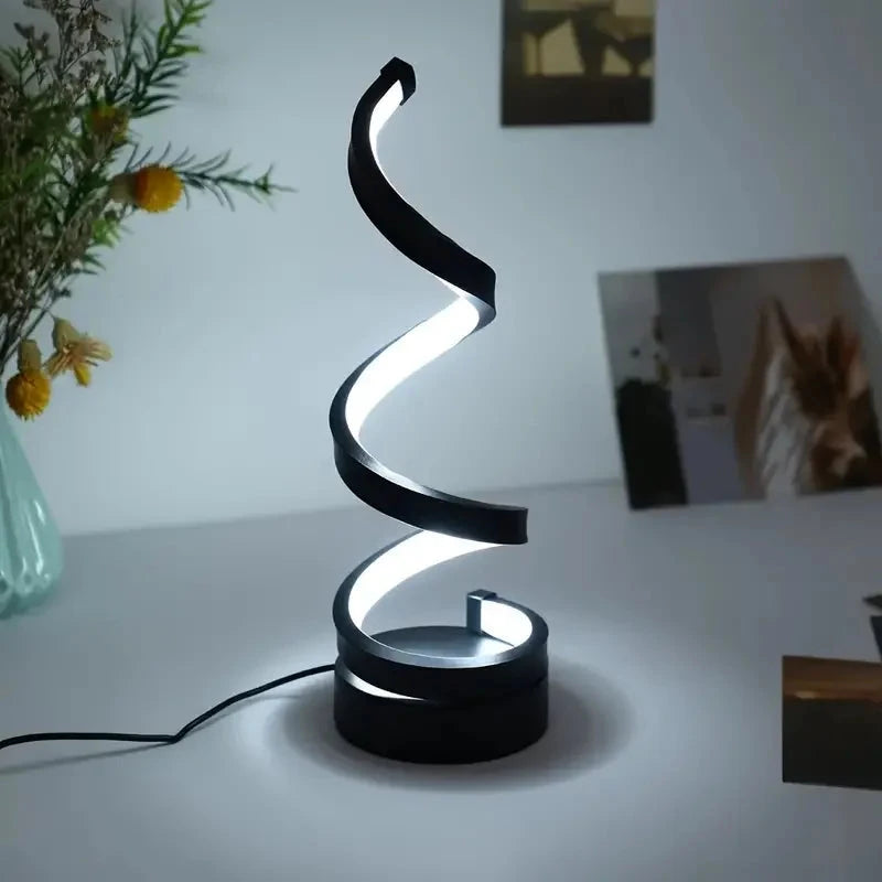 Modern spiral LED table lamp for desk and home lighting decor.