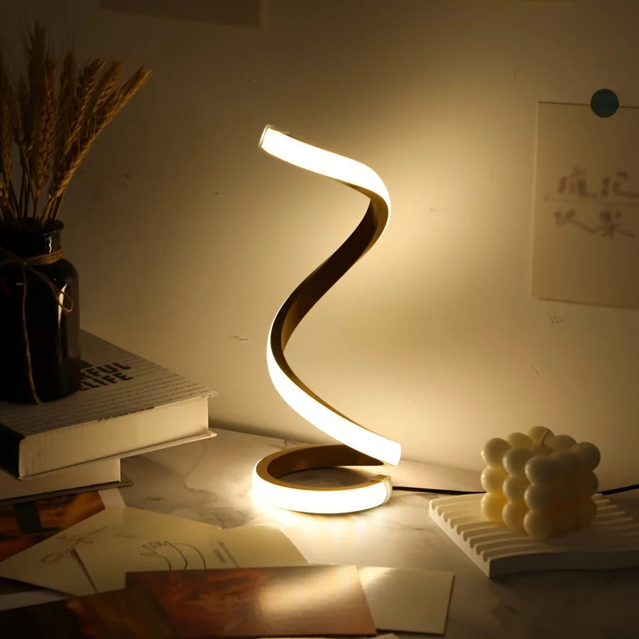 Modern spiral LED table lamp for desk and home lighting decor.