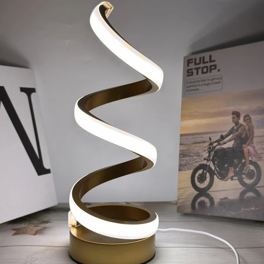 Modern spiral LED table lamp for desk and home lighting decor.