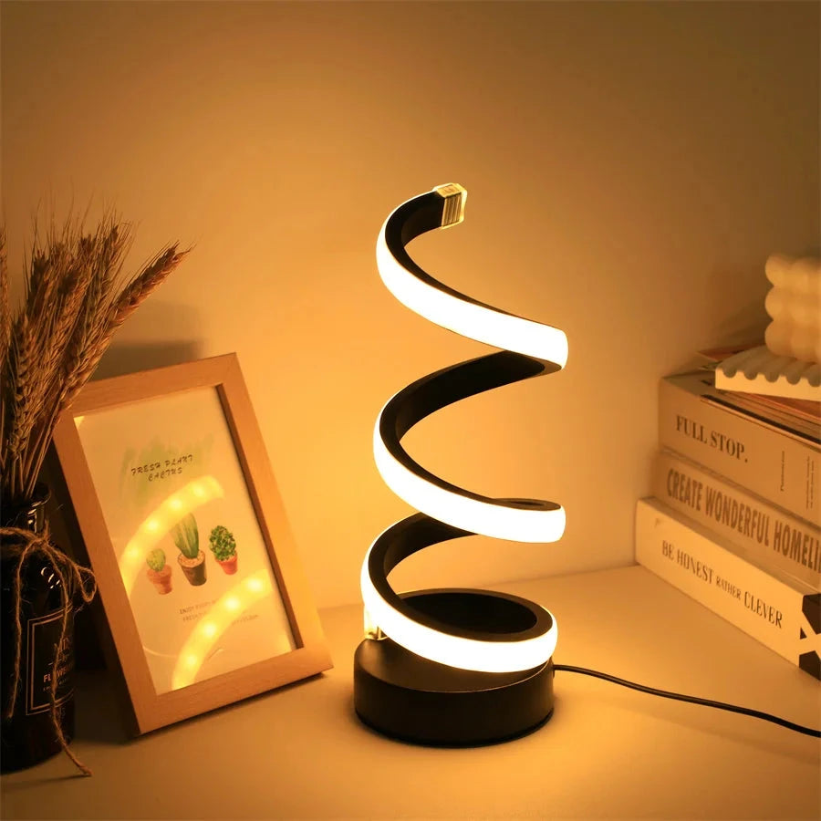 Modern spiral LED table lamp for desk and home lighting decor.