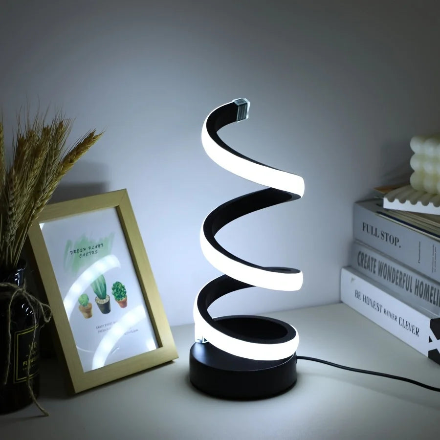 Modern spiral LED table lamp for desk and home lighting decor.