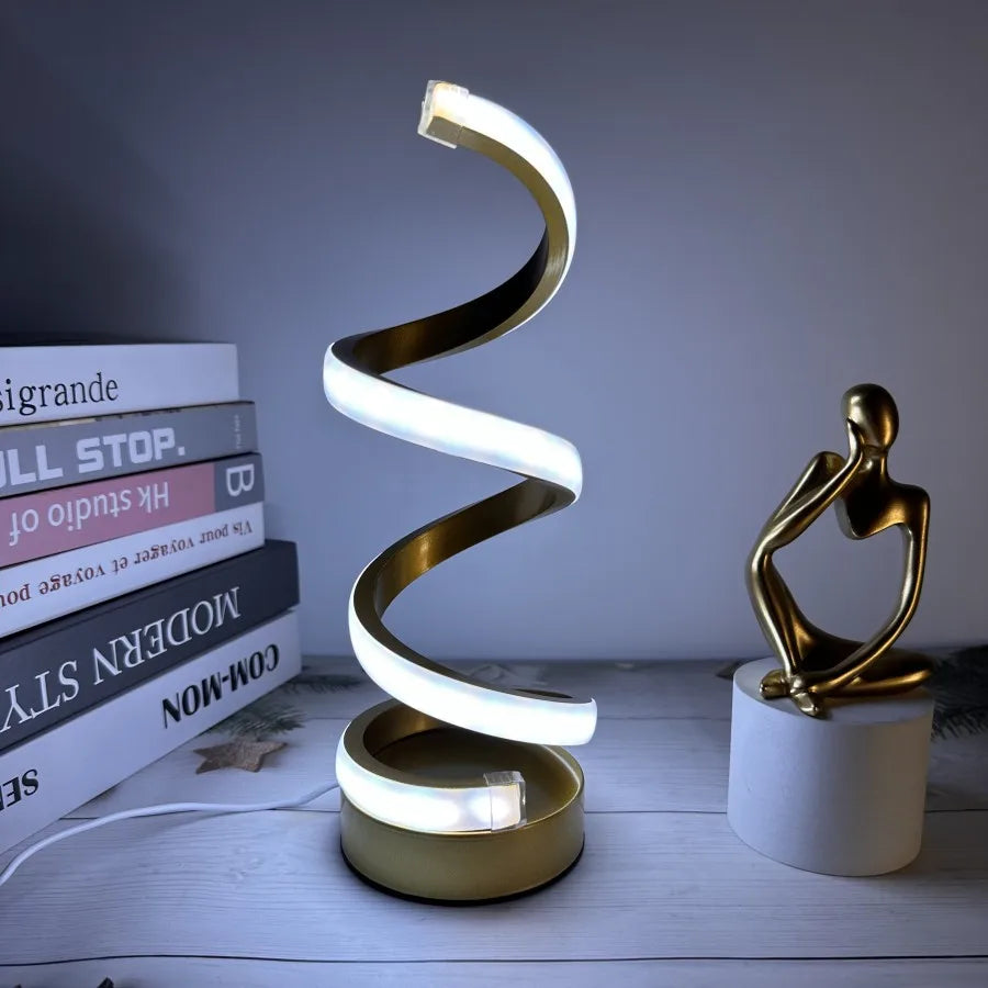 Modern spiral LED table lamp for desk and home lighting decor.