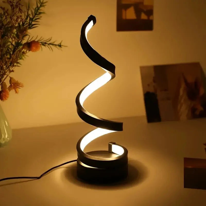 Modern spiral LED table lamp for desk and home lighting decor.