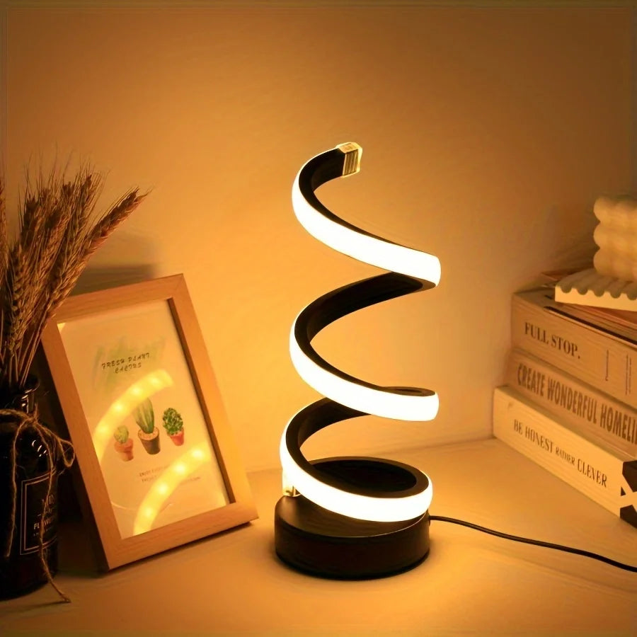 Modern spiral LED table lamp for desk and home lighting decor.