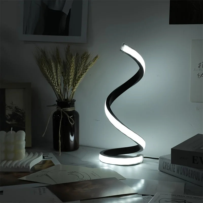 Modern spiral LED table lamp for desk and home lighting decor.