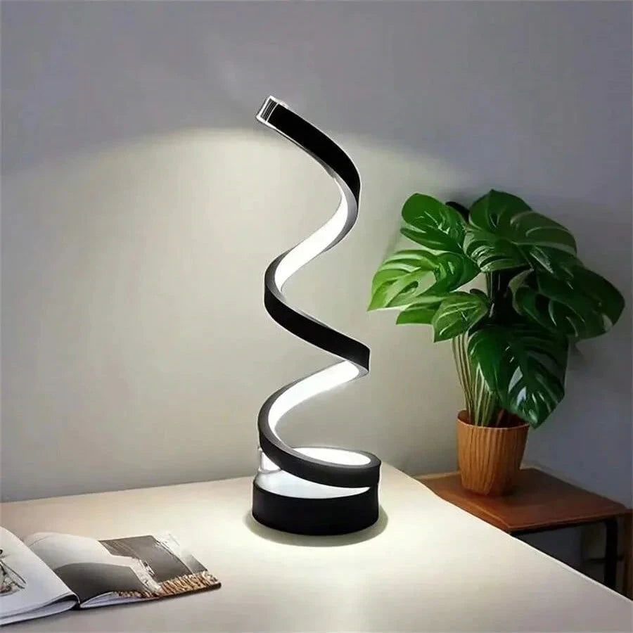 Modern spiral LED table lamp for desk and home lighting decor.